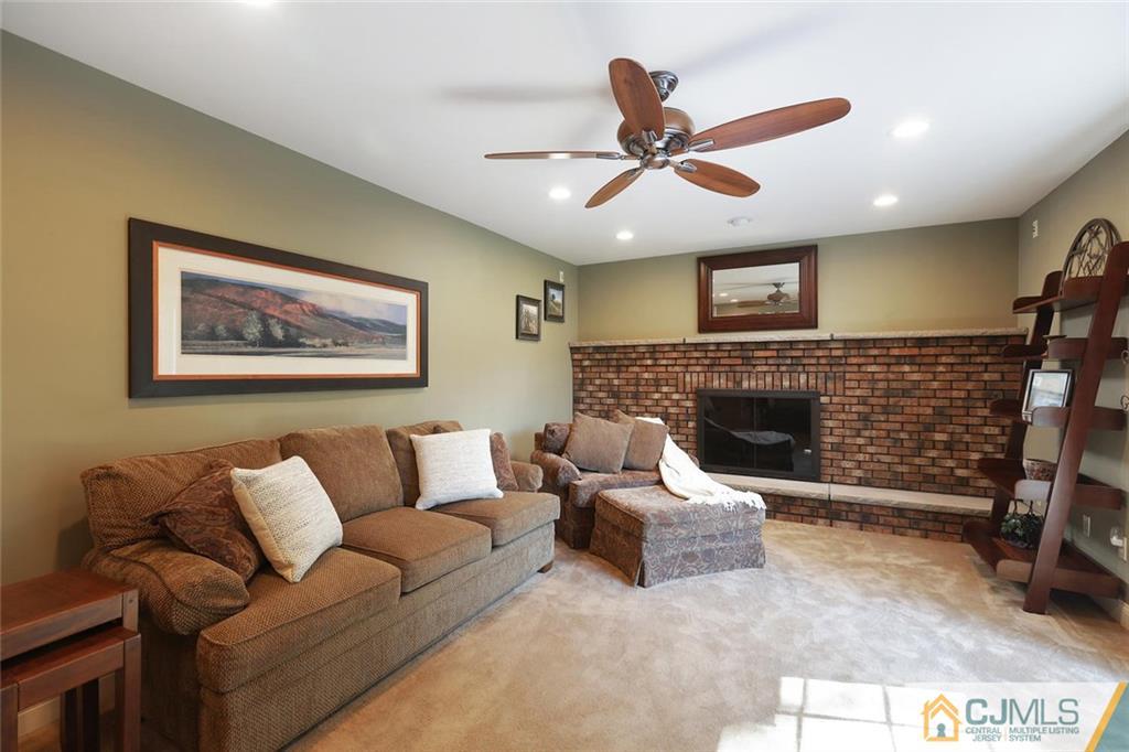 203 Normandy Road Edison, NJ 08820 - Photo 12 of 32 a living room with furniture and a fireplace