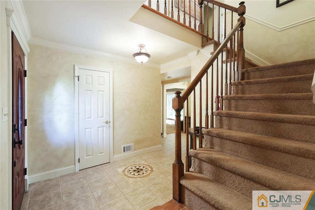 203 Normandy Road Edison, NJ 08820 - Photo 15 of 32 a view of entryway with stairs