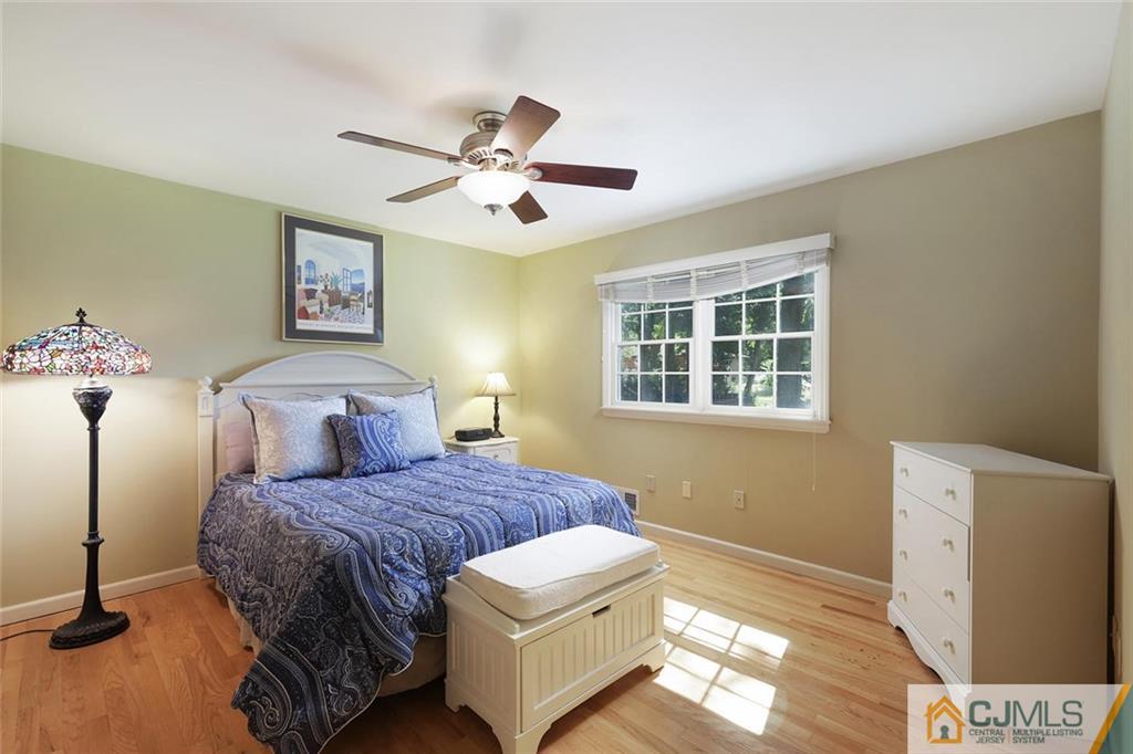 203 Normandy Road Edison, NJ 08820 - Photo 19 of 32 a bedroom with a bed and a window