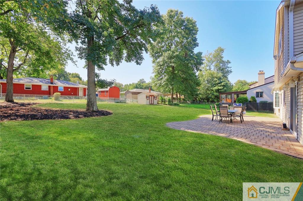 203 Normandy Road Edison, NJ 08820 - Photo 23 of 32 a view of a park with bench and trees