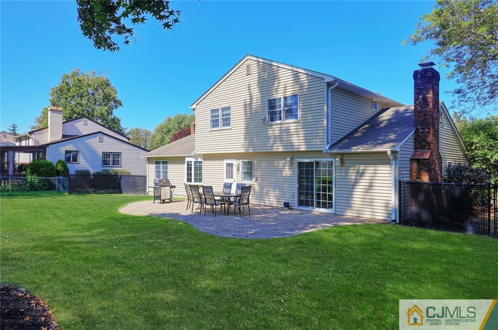 203 Normandy Road Edison, NJ 08820 - Photo 24 of 32 a front view of a house with garden and chairs
