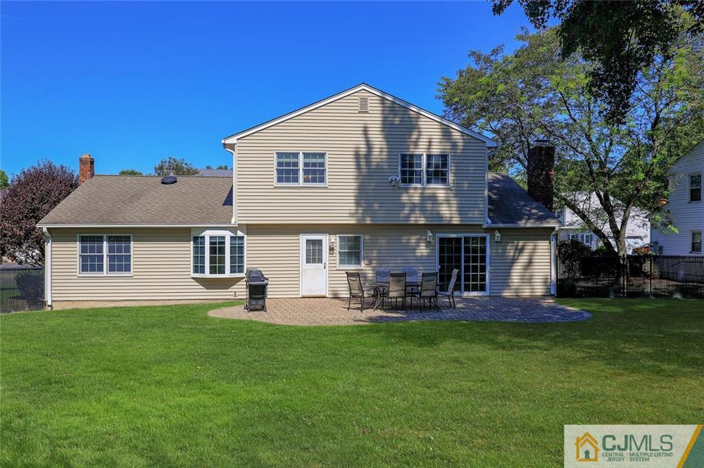 203 Normandy Road Edison, NJ 08820 - Photo 25 of 32 a front view of a house with a garden and sitting area