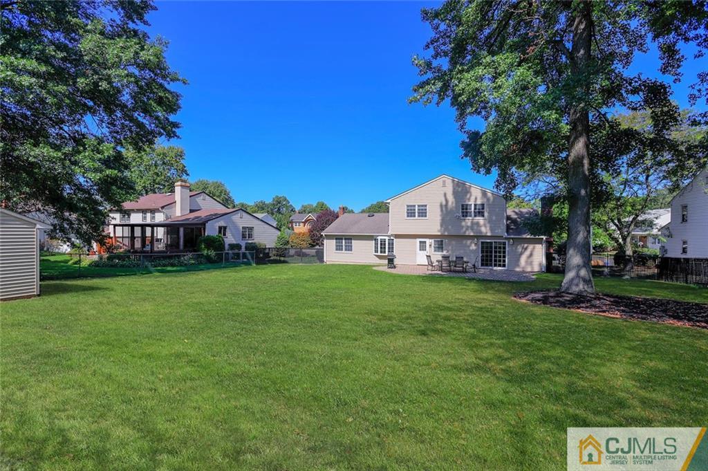 203 Normandy Road Edison, NJ 08820 - Photo 26 of 32 a view of a house with a big yard and large trees