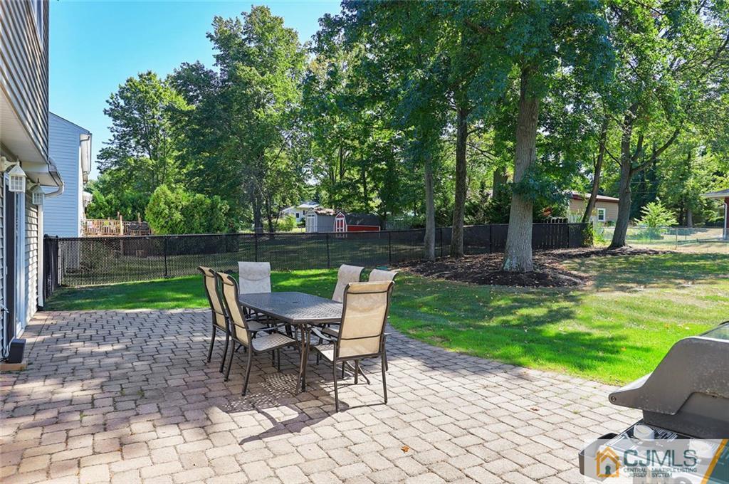203 Normandy Road Edison, NJ 08820 - Photo 27 of 32 a view of a chair and table in the garden