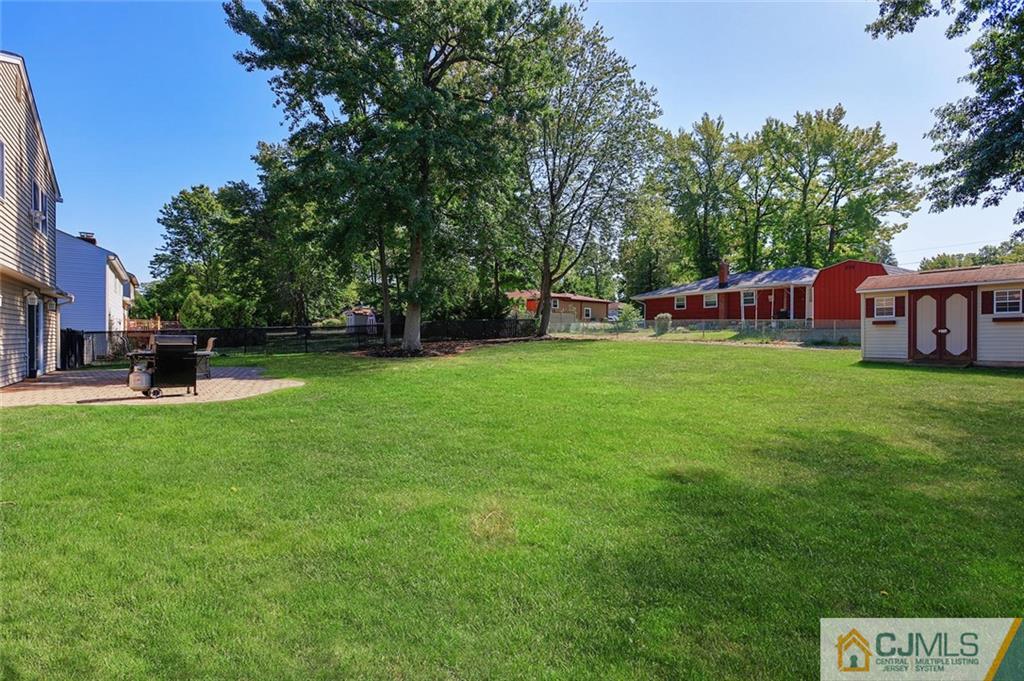 203 Normandy Road Edison, NJ 08820 - Photo 28 of 32 a view of a house with a backyard porch and sitting area