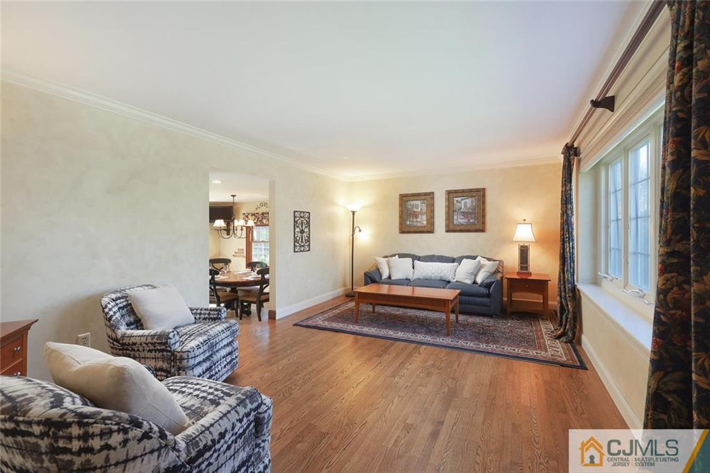 203 Normandy Road Edison, NJ 08820 - Photo 5 of 32 a living room with furniture or couch and a dresser