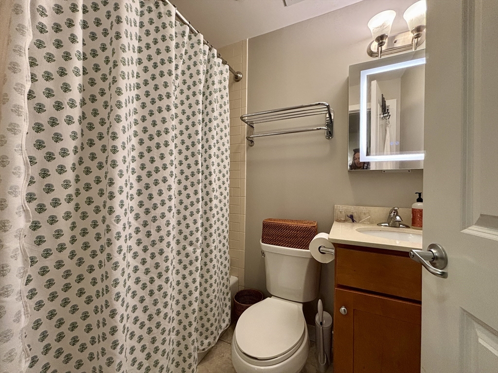 20 Parmenter Street, Unit 403 Boston, MA 02113 - Photo 10 of 16 a white toilet sitting next to a bathroom sink