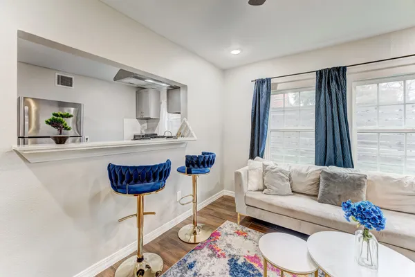 a living room with furniture and a large window