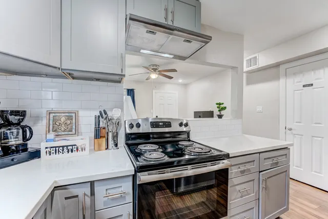 a bedroom with a bed tv and a window