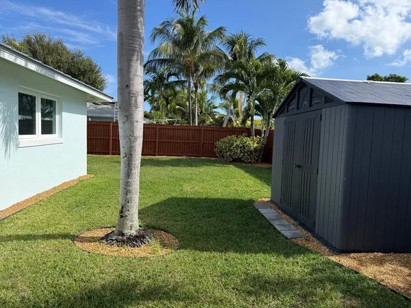 a view of a backyard with a cabin