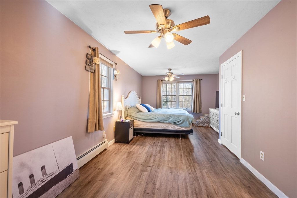 164 Turkey Hill Road Rutland, MA 01543 - Photo 11 of 30 a bedroom with a bed and a large window