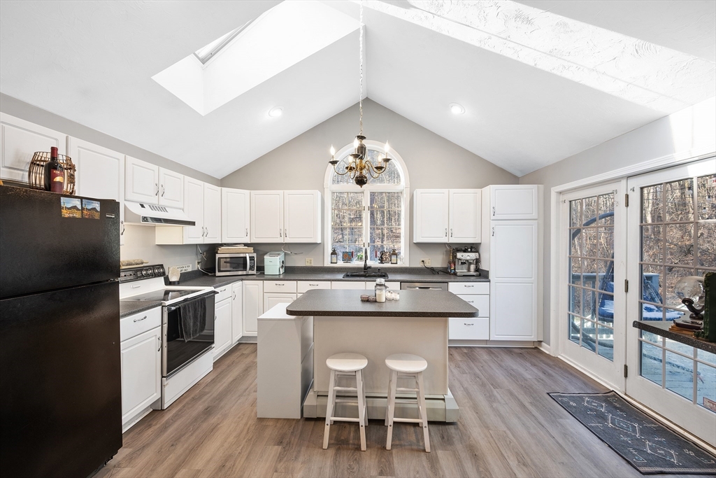 164 Turkey Hill Road Rutland, MA 01543 - Photo 2 of 30 a kitchen with kitchen island granite countertop a sink window and stainless steel appliances