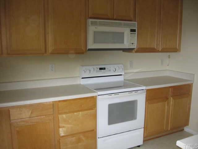 5312 Seaspray Lane Raleigh, NC 27610 - Photo 6 of 12 Kitchen includes a flat top stove and built in microwave Other