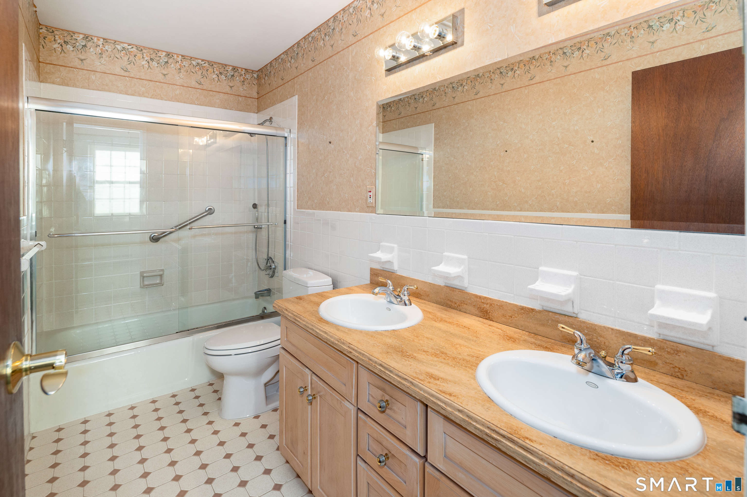 240 Wardwell Street, Unit 26 Stamford, CT 06902 - Photo 18 of 28 a bathroom with a sink a toilet and shower