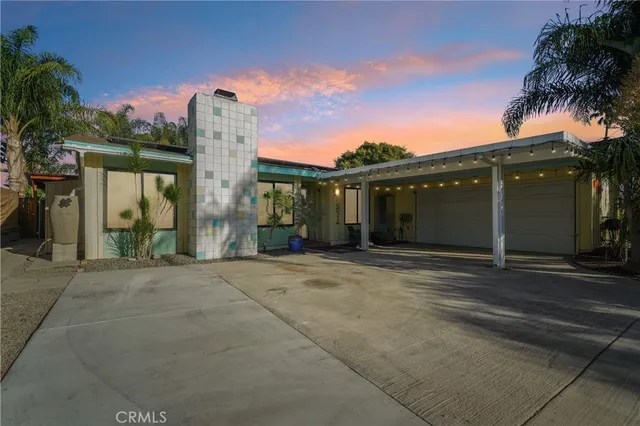 front view of a house with a garden