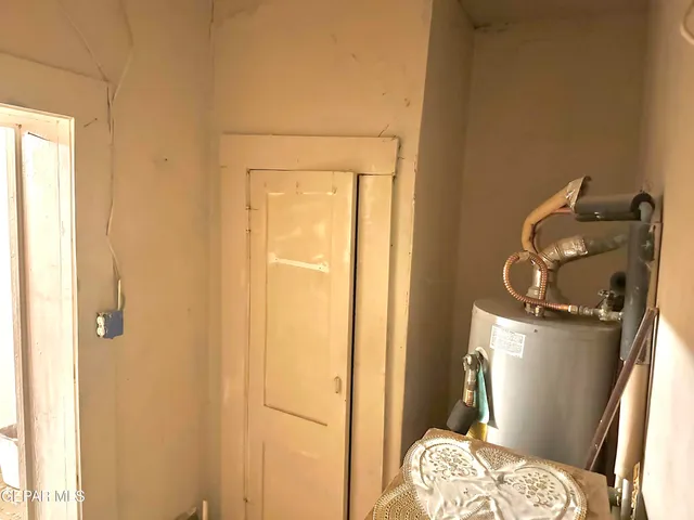 a bedroom with a bed and a furniture