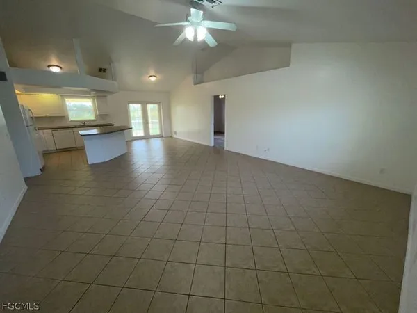 a view of a kitchen with a sink and a window
