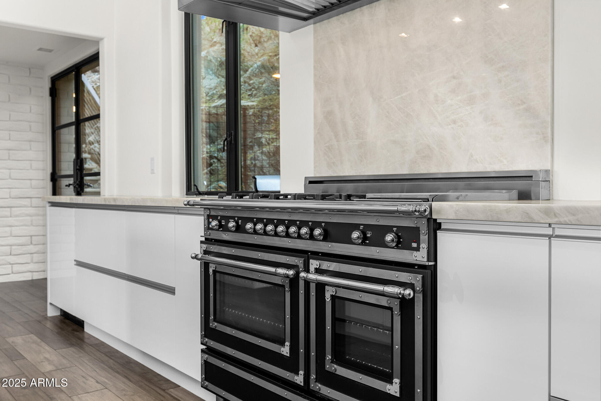 4129 East Sandy Mountain Road Paradise Valley, AZ 85253 - Photo 17 of 76 a stove top oven sitting inside of a kitchen