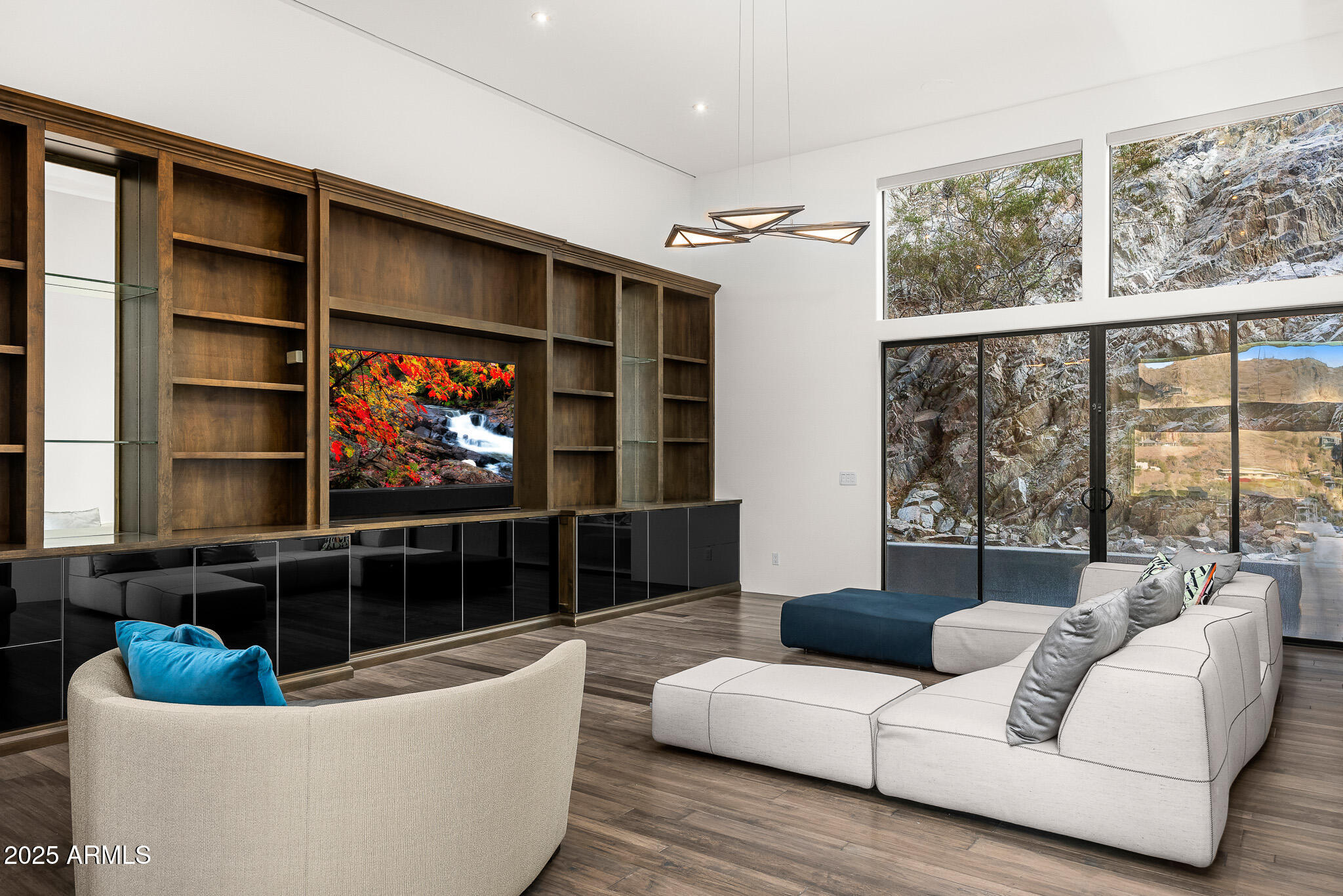 4129 East Sandy Mountain Road Paradise Valley, AZ 85253 - Photo 22 of 76 a living room with furniture a window and a flat screen tv