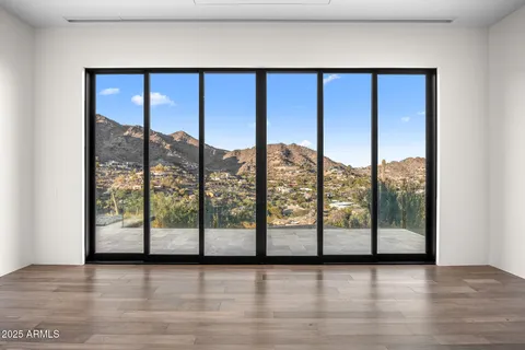 a bathroom with a white tub shower and sink