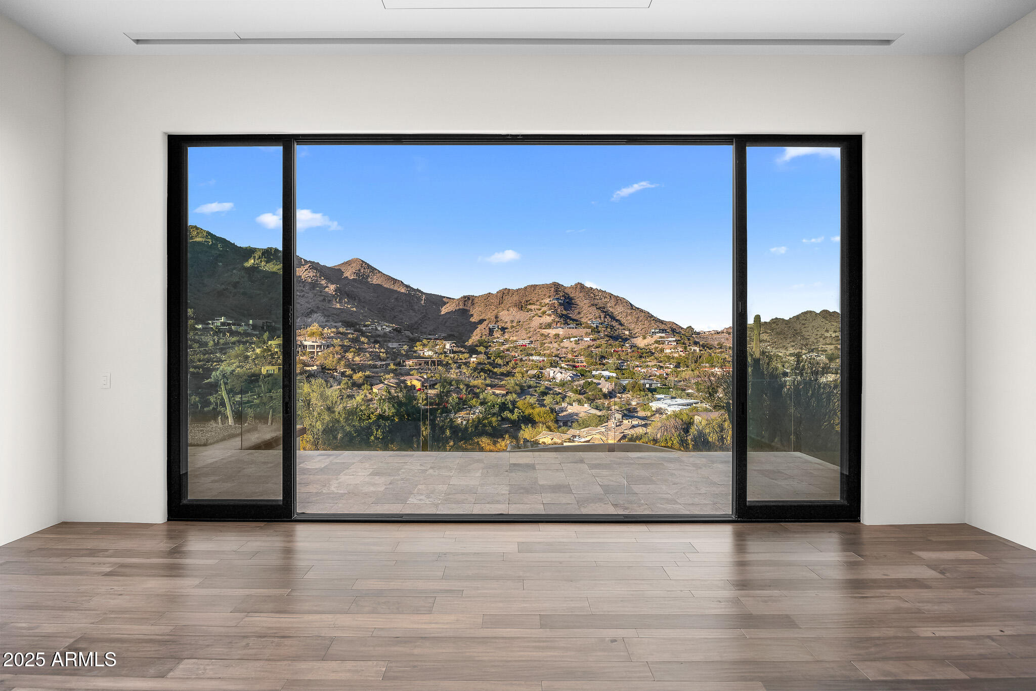 4129 East Sandy Mountain Road Paradise Valley, AZ 85253 - Photo 28 of 76 a view of a big room with wooden floor and mountain view