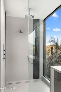 an empty room with wooden floor chandelier fan and closet area