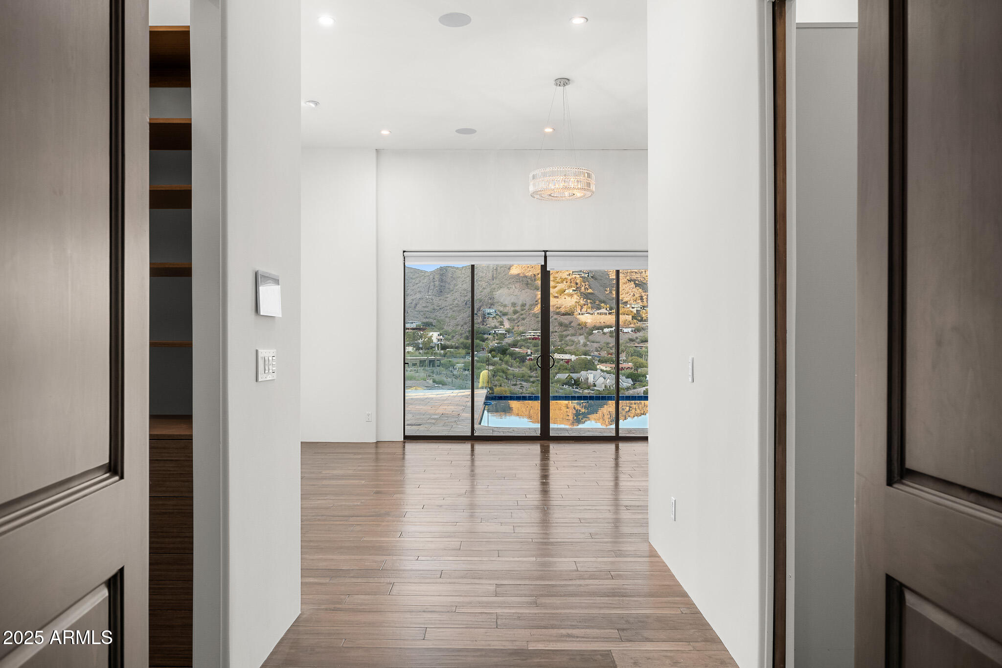 4129 East Sandy Mountain Road Paradise Valley, AZ 85253 - Photo 39 of 76 a view of hallway with a large window and wooden floor