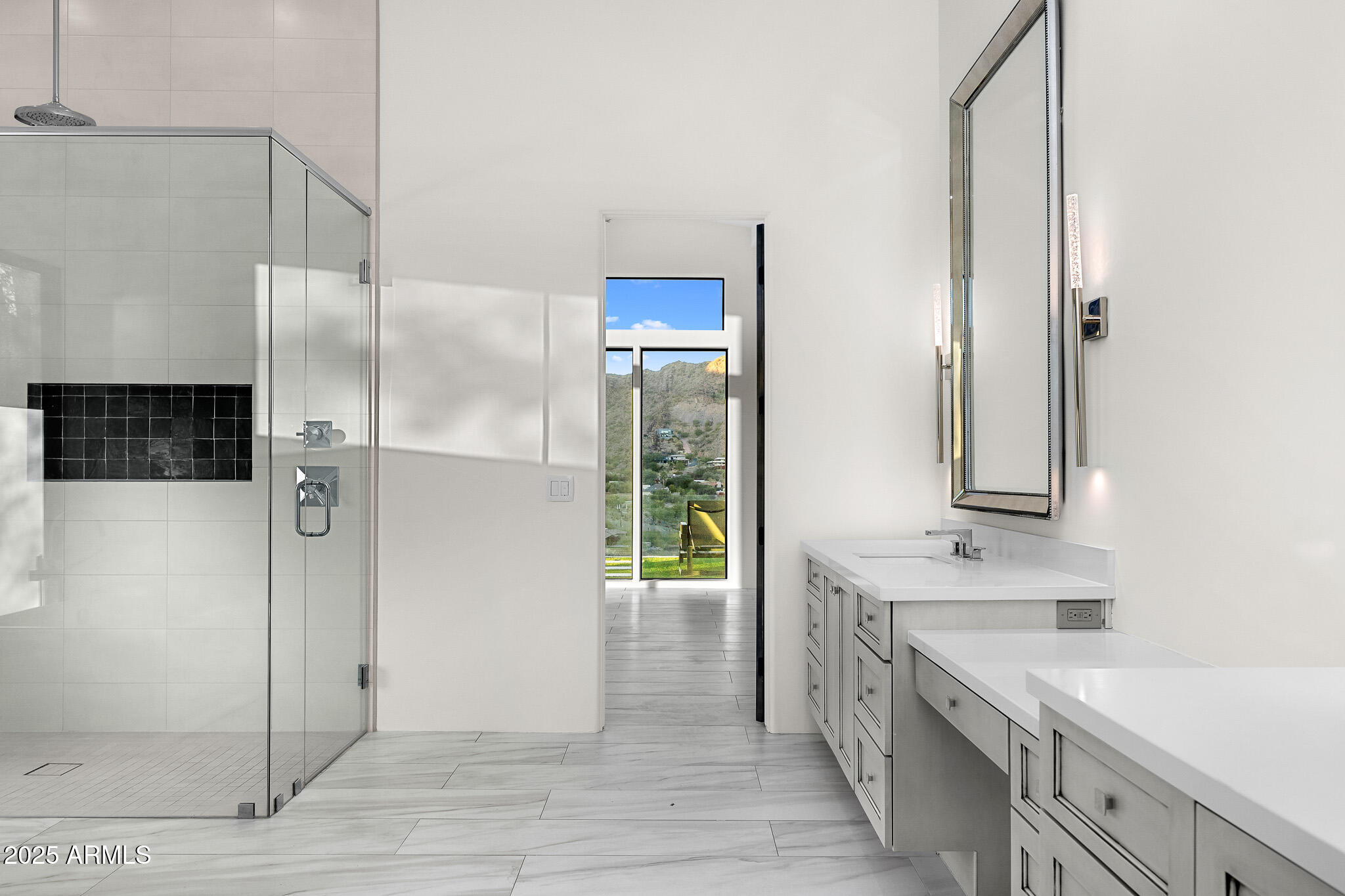 4129 East Sandy Mountain Road Paradise Valley, AZ 85253 - Photo 41 of 76 a bathroom with a double vanity sink a mirror and a shower