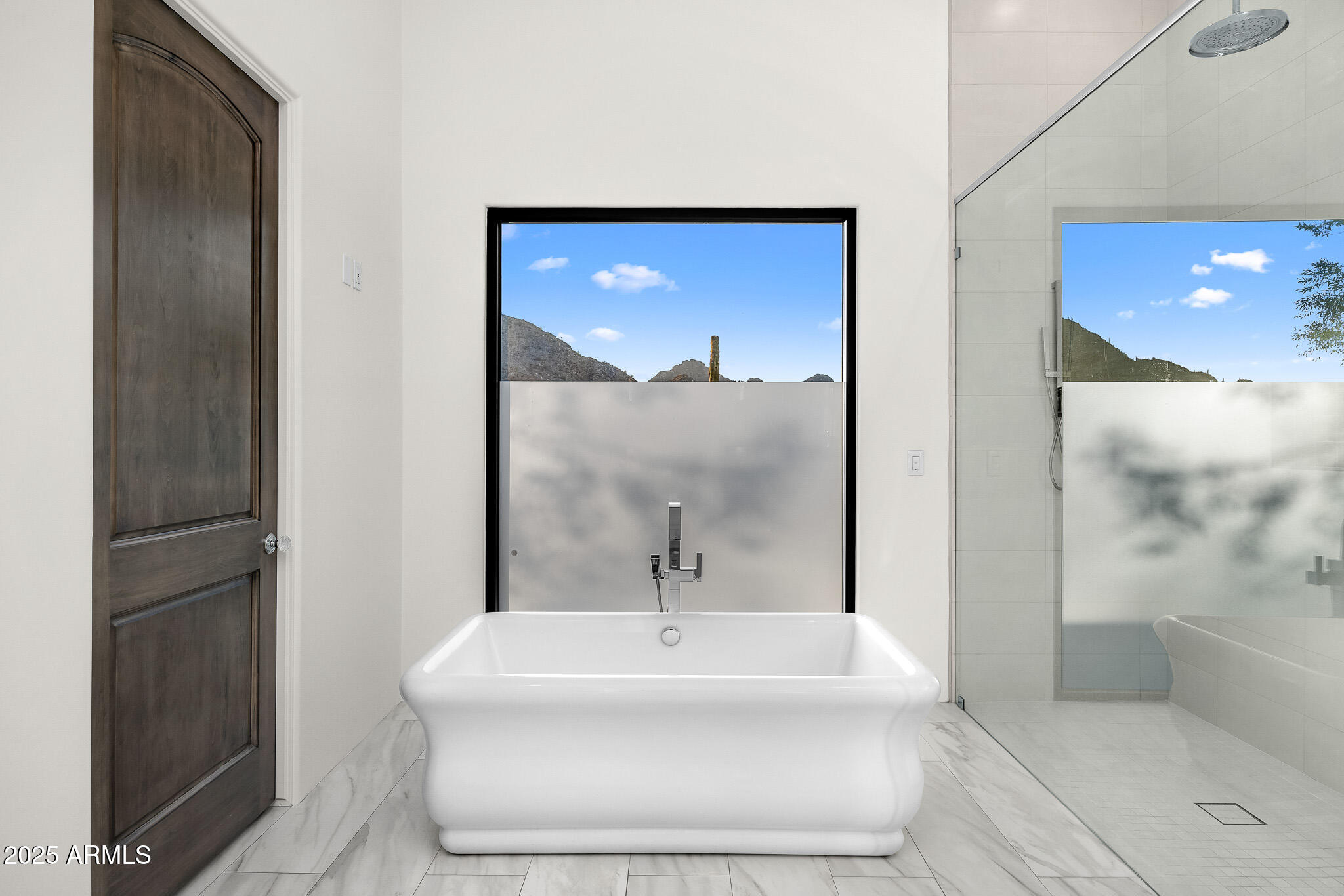 4129 East Sandy Mountain Road Paradise Valley, AZ 85253 - Photo 42 of 76 a bathroom with a white tub shower and sink