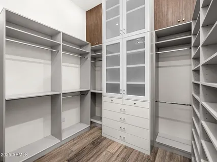 a kitchen with a sink cabinets and window