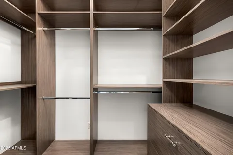 a kitchen with sink stove and cabinets