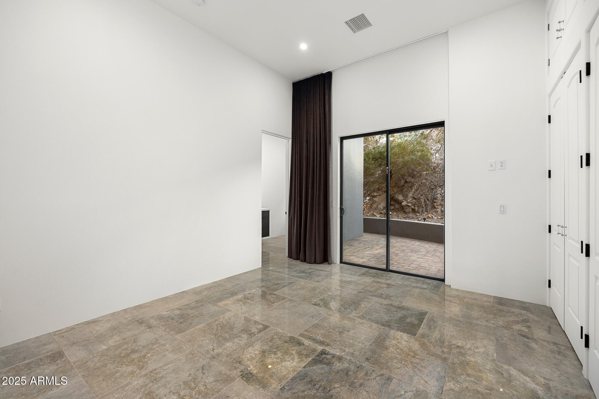 4129 East Sandy Mountain Road Paradise Valley, AZ 85253 - Photo 45 of 76 a view of a big room with sliding door and mountain view