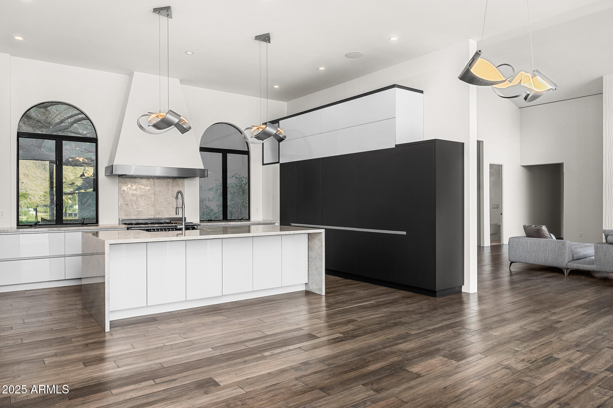 4129 East Sandy Mountain Road Paradise Valley, AZ 85253 - Photo 5 of 76 a kitchen with stainless steel appliances kitchen island a refrigerator and a stove