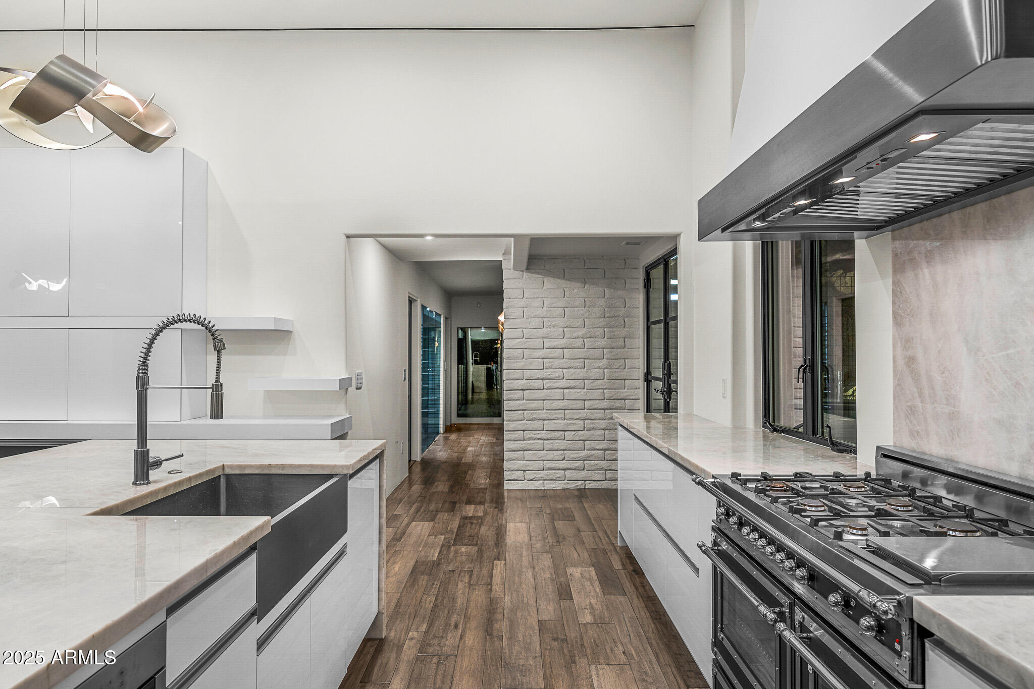 4129 East Sandy Mountain Road Paradise Valley, AZ 85253 - Photo 65 of 76 a kitchen with sink stove and cabinets