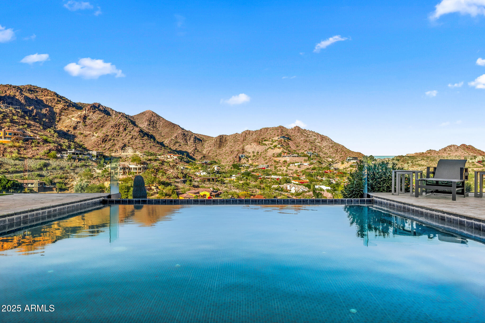 4129 East Sandy Mountain Road Paradise Valley, AZ 85253 - Photo 8 of 76 a view of a lake with a mountain in the background
