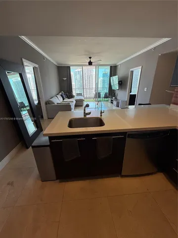 a view of a room with furniture and window