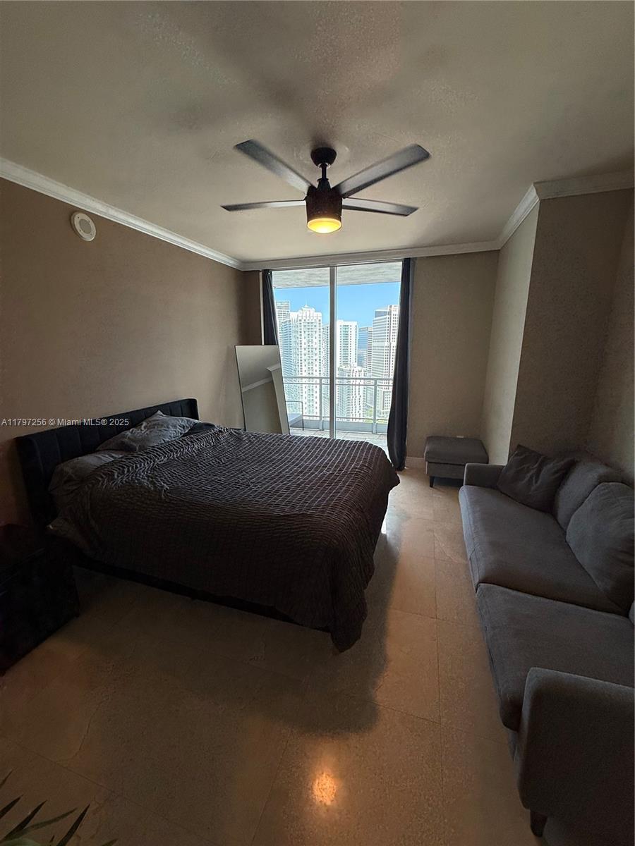90 Southwest 3rd Street, Unit 3601 Miami, FL 33130 - Photo 16 of 49 a bedroom with a bed ceiling fan and a window