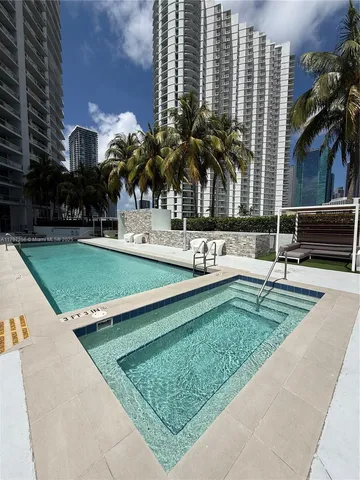 a view of a swimming pool with a patio