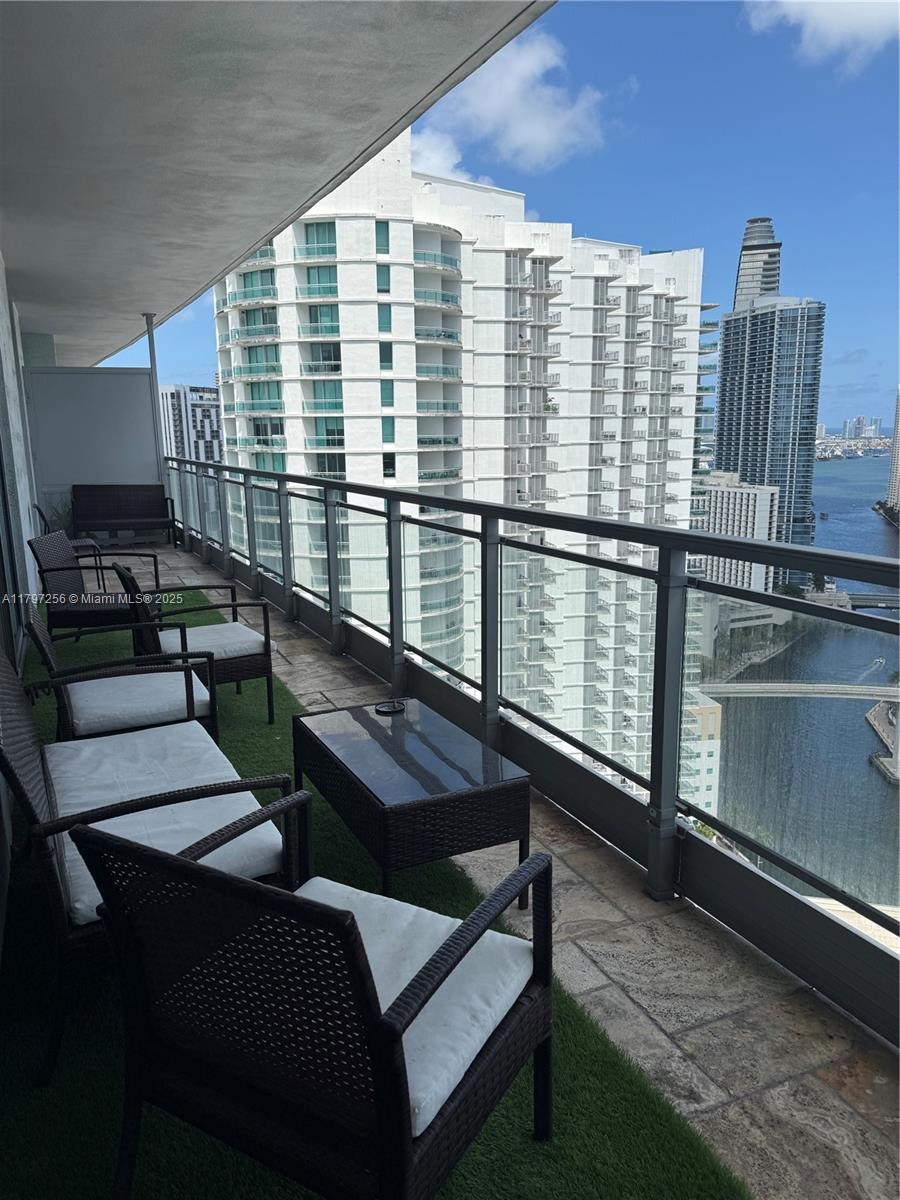 90 Southwest 3rd Street, Unit 3601 Miami, FL 33130 - Photo 22 of 49 a view of a balcony with chairs
