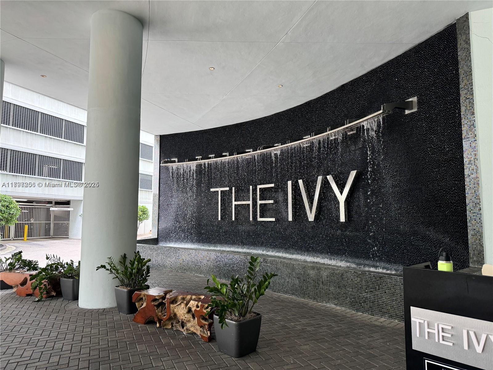 90 Southwest 3rd Street, Unit 3601 Miami, FL 33130 - Photo 30 of 49 a building with potted plants in front of door