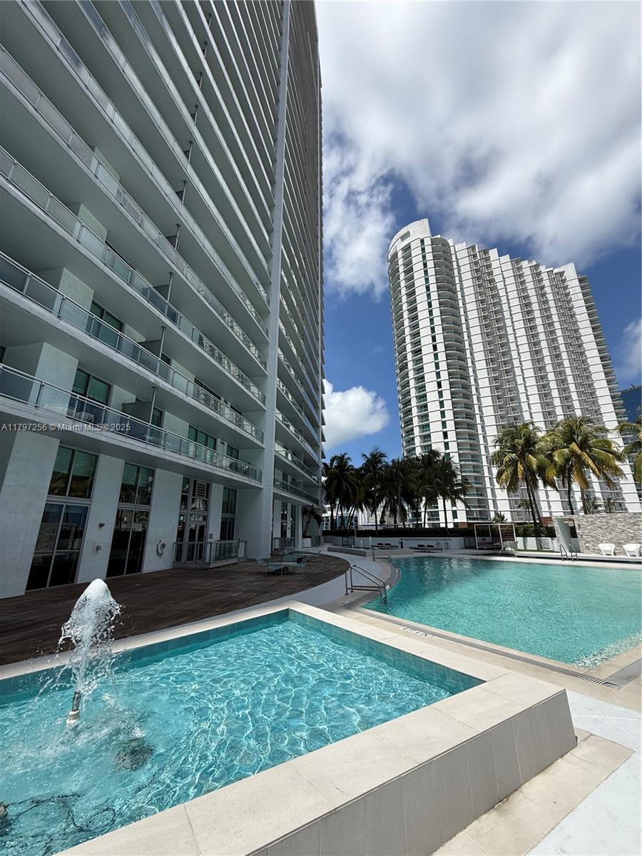 90 Southwest 3rd Street, Unit 3601 Miami, FL 33130 - Photo 3 of 49 a view of building with yard