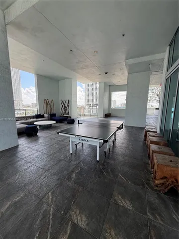 a room with lots of furniture and a view of living room