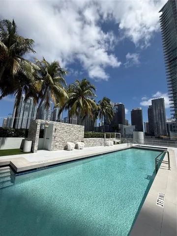 a view of a swimming pool with a garden