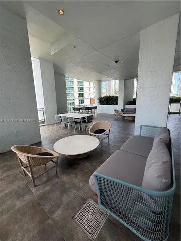 a living room with furniture a window and a table