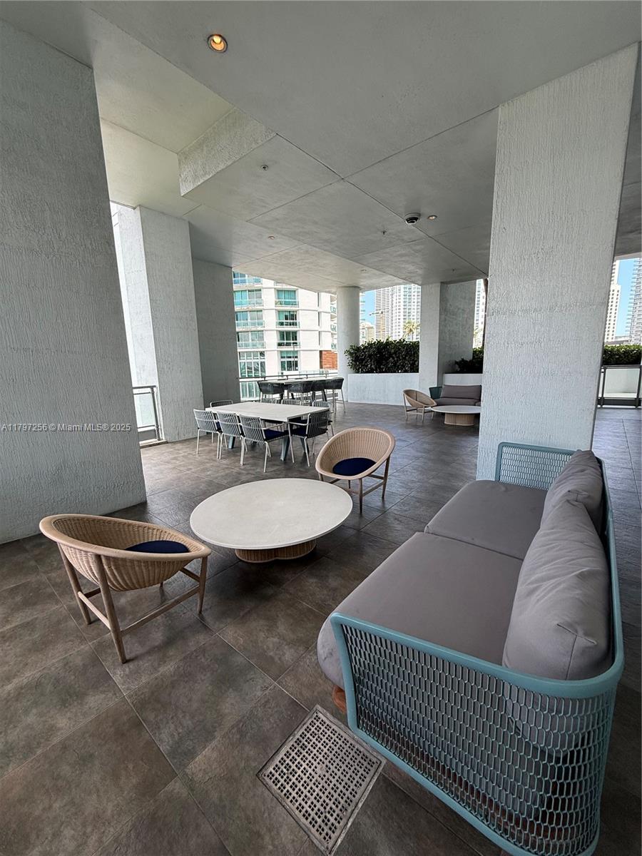 90 Southwest 3rd Street, Unit 3601 Miami, FL 33130 - Photo 34 of 49 a living room with furniture a window and a table