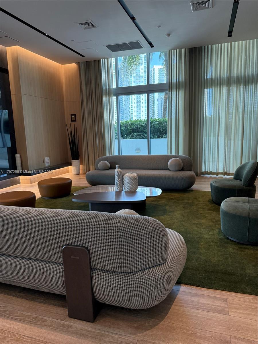 90 Southwest 3rd Street, Unit 3601 Miami, FL 33130 - Photo 43 of 49 a living room with furniture and a large window