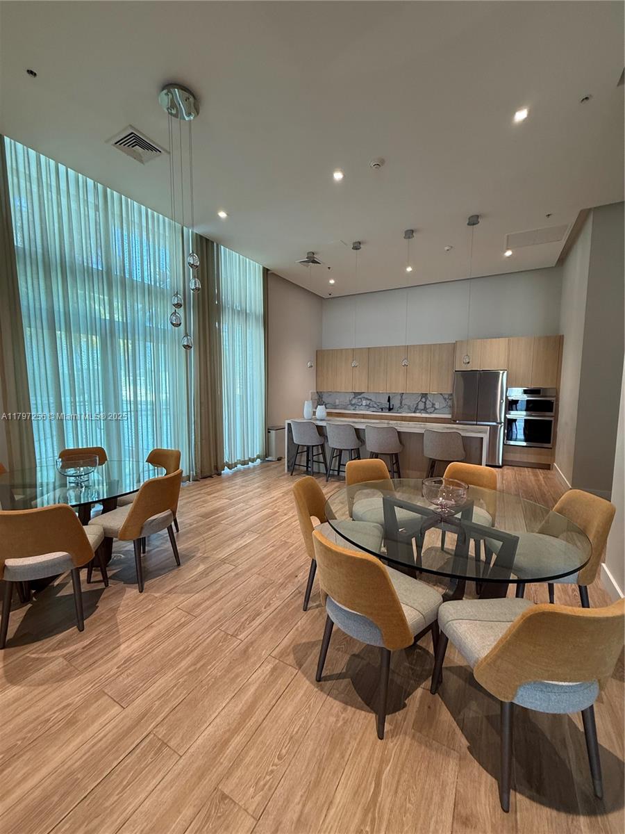 90 Southwest 3rd Street, Unit 3601 Miami, FL 33130 - Photo 44 of 49 a living room with furniture and a large window