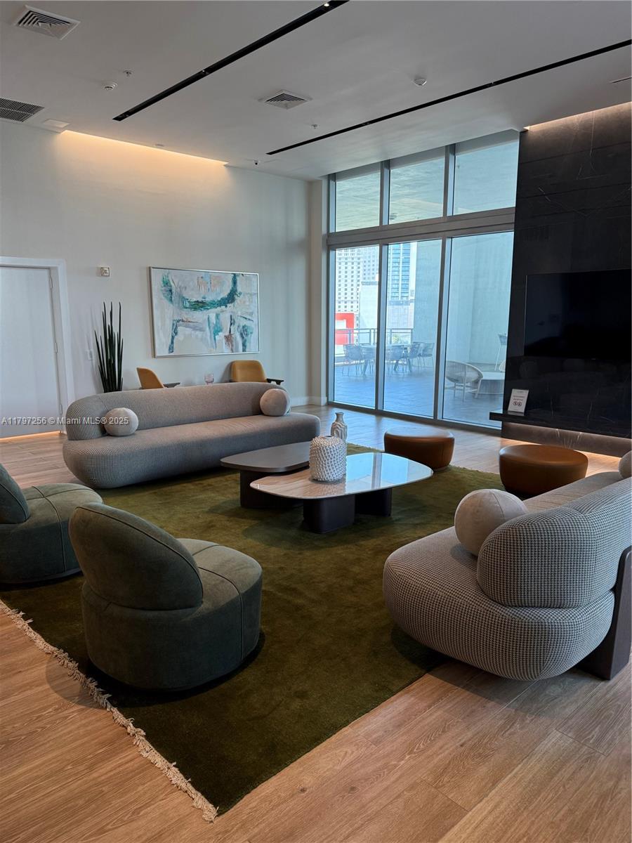 90 Southwest 3rd Street, Unit 3601 Miami, FL 33130 - Photo 48 of 49 a living room with furniture and a flat screen tv