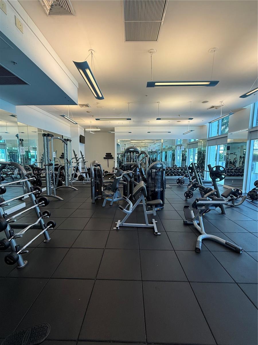 90 Southwest 3rd Street, Unit 3601 Miami, FL 33130 - Photo 6 of 49 a view of a room with gym equipment