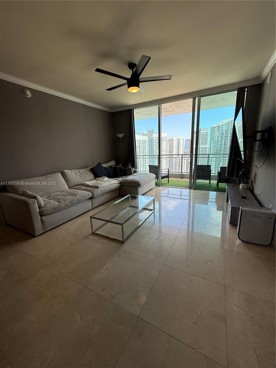 90 Southwest 3rd Street, Unit 3601 Miami, FL 33130 - Photo 10 of 49 a living room with furniture and a flat screen tv